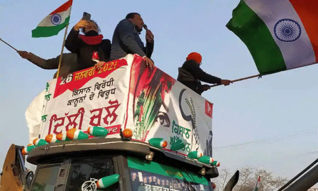 Farmers hold tractor march against farm laws, break Delhi Police barricade