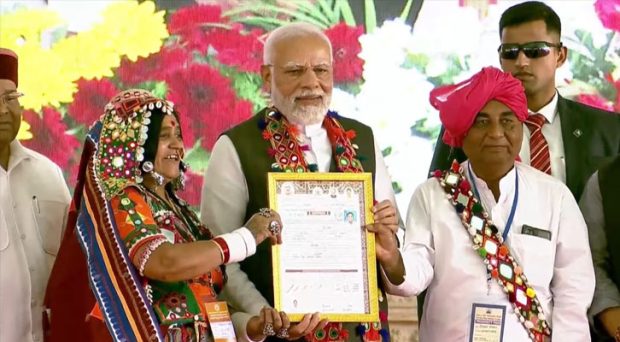 PM Modi distributes title deeds of new revenue villages to beneficiaries at Malkhed