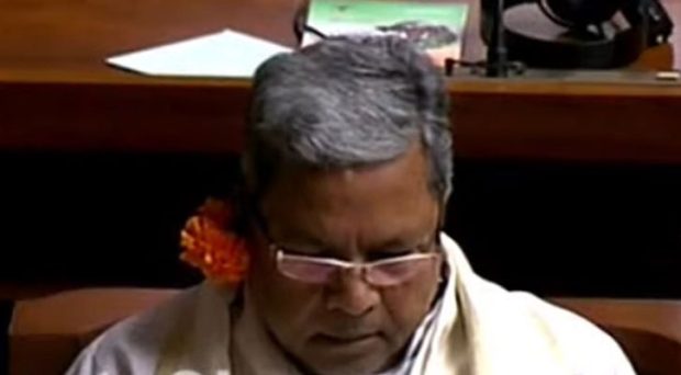 Siddaramaiah with flower on his ears at budget session