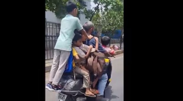 Mumbai man rides scooter with 7 children
